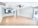 Open-concept living room with a fan, tile flooring, and an open transition to the kitchen area at 1326 N Jones Blvd, Las Vegas, NV 89108