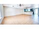Spacious living room with tile flooring and a ceiling fan, leading to an open kitchen at 1326 N Jones Blvd, Las Vegas, NV 89108