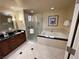 Spacious bathroom featuring double sinks, a walk-in shower, and a luxurious soaking tub at 135 E Harmon Ave # 3217, Las Vegas, NV 89109