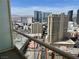 Balcony view featuring several buildings and a parking garage from the balcony of this unit at 135 E Harmon Ave # 3217, Las Vegas, NV 89109