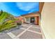 A lovely back patio with decorative rockwork and a decorative concrete patio in a well maintained backyard at 14 Hunt Valley Trl, Henderson, NV 89052