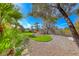 Backyard featuring a rock garden, artificial turf, gravel, and desert landscaping at 14 Hunt Valley Trl, Henderson, NV 89052