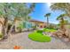 Beautiful backyard featuring an artificial grass area and rock garden at 14 Hunt Valley Trl, Henderson, NV 89052