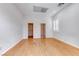 Empty bonus room with wooden floors, closet storage, and a window with natural light at 14 Hunt Valley Trl, Henderson, NV 89052