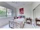 Comfortable bedroom with ample natural light, carpet floors and a side table at 14 Hunt Valley Trl, Henderson, NV 89052