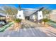 Welcoming building entrance with a unique pergola and landscaping, creating an inviting atmosphere at 14 Hunt Valley Trl, Henderson, NV 89052