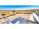 Scenic view of the golf course, golf carts, and surrounding landscape from an elevated perspective at 14 Hunt Valley Trl, Henderson, NV 89052