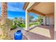 An outdoor living space boasting a covered patio and views of the landscaped backyard at 14 Hunt Valley Trl, Henderson, NV 89052