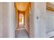 View of a private walkway leading to the front entrance of the home, with arched gates on either end at 14 Hunt Valley Trl, Henderson, NV 89052