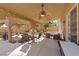 Expansive covered patio with dual ceiling fans, string lights, and ample seating perfect for outdoor enjoyment at 1508 Sun Copper Dr, Las Vegas, NV 89117