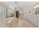 Spacious bathroom featuring a tub, glass enclosed shower, vanity with double sinks, and large mirror at 1508 Sun Copper Dr, Las Vegas, NV 89117
