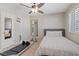 Bright bedroom featuring a ceiling fan, single bed, and large wall mirror for a spacious feel at 1508 Sun Copper Dr, Las Vegas, NV 89117