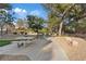 View of a concrete picnic table in a community park setting with a walking path at 1508 Sun Copper Dr, Las Vegas, NV 89117