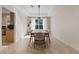 Inviting dining area features a modern light fixture and a view of the backyard at 1508 Sun Copper Dr, Las Vegas, NV 89117