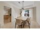 Bright dining room with modern light fixture and view of the backyard at 1508 Sun Copper Dr, Las Vegas, NV 89117
