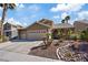 Beautiful home with a three-car garage and desert landscaping at 1508 Sun Copper Dr, Las Vegas, NV 89117