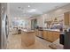 Bright kitchen with granite countertops, stainless steel appliances, and an island, flowing into the living area at 1508 Sun Copper Dr, Las Vegas, NV 89117
