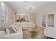 Spacious living area with an open floorplan, neutral colors, and modern lighting at 1508 Sun Copper Dr, Las Vegas, NV 89117