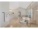 Elegant main bathroom featuring a walk-in shower, a soaking tub, and double vanities at 1508 Sun Copper Dr, Las Vegas, NV 89117