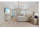 Spacious main bedroom featuring neutral tones, a ceiling fan, and shuttered windows at 1508 Sun Copper Dr, Las Vegas, NV 89117