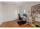 Home office with hardwood floors, a work desk, and a bright window with shutters at 1508 Sun Copper Dr, Las Vegas, NV 89117