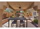 Under the covered patio, you'll find an outdoor dining table, grill, seating area, and desert landscaping at 1508 Sun Copper Dr, Las Vegas, NV 89117