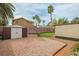 The backyard features gravel, a shed, and a small patch of grass at 1837 Alicant Way, Henderson, NV 89014