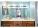Bathroom vanity with double sinks and view into bedroom at 1837 Alicant Way, Henderson, NV 89014