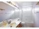 This bathroom has dual sinks, a tub and shower combination, and a large mirror at 1837 Alicant Way, Henderson, NV 89014