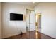 This bedroom features laminate flooring and a mounted flat-screen television at 1837 Alicant Way, Henderson, NV 89014