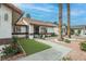 Charming front garden with vibrant flowers leads to a cozy single-story home at 1837 Alicant Way, Henderson, NV 89014