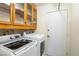 This laundry room features a modern washer and dryer at 1837 Alicant Way, Henderson, NV 89014