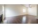 Bright living room with fireplace, elegant dark wood floors, and large windows at 1837 Alicant Way, Henderson, NV 89014
