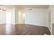 Spacious living room with tile and wood flooring and access to outdoor patio at 1837 Alicant Way, Henderson, NV 89014