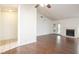 Bright living room featuring wood floors, ceiling fan, and access to outdoor patio at 1837 Alicant Way, Henderson, NV 89014