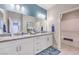 The bathroom boasts dual sinks, granite countertops, and a separate shower and tub at 1921 Lewis Bay Ave # Lot 21, North Las Vegas, NV 89084