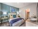Comfortable bedroom with stylish decor, soft lighting, and a view of a spacious closet at 1921 Lewis Bay Ave # Lot 21, North Las Vegas, NV 89084