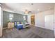 Bright bedroom featuring a geometric accent wall, ceiling fan, and ensuite bathroom entrance at 1921 Lewis Bay Ave # Lot 21, North Las Vegas, NV 89084