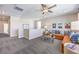 Spacious upstairs living room with an orange couch and tasteful decor creating a comfortable and inviting space at 1921 Lewis Bay Ave # Lot 21, North Las Vegas, NV 89084
