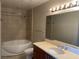 Bathroom featuring a soaking tub, tiled walls, and a vanity with a sink and a large mirror at 200 W Sahara Ave # 2211, Las Vegas, NV 89102