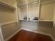 Organized walk-in closet with shelving units and hanging rods, maximizing storage in the bedroom at 200 W Sahara Ave # 2211, Las Vegas, NV 89102
