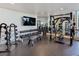 Modern gym equipped with weights, benches, and a mirrored wall for effective training at 200 W Sahara Ave # 2211, Las Vegas, NV 89102