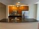 Contemporary kitchen with stainless steel appliances, dark granite countertops, and light wood cabinetry at 200 W Sahara Ave # 2211, Las Vegas, NV 89102