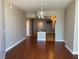 Spacious living room with hardwood floors, a ceiling fan, and a kitchen area, creating an open layout at 200 W Sahara Ave # 2211, Las Vegas, NV 89102
