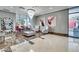 An inviting lobby features modern lighting, chairs, a mirrored wall, and marble and tile floors at 200 W Sahara Ave # 2211, Las Vegas, NV 89102