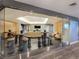 Lounge area with tables, seating, television, and large glass wall at 200 W Sahara Ave # 2211, Las Vegas, NV 89102
