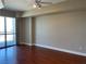 Spacious main bedroom with hardwood floors and large windows providing natural light and city views at 200 W Sahara Ave # 2211, Las Vegas, NV 89102
