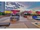 The rooftop deck has outdoor seating, a bar with TVs, and unique decorative trees at 200 W Sahara Ave # 2211, Las Vegas, NV 89102