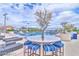 A rooftop deck is equipped with lounge chairs and picnic tables surrounding the community pool at 200 W Sahara Ave # 2211, Las Vegas, NV 89102