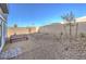 Private backyard featuring gravel landscaping with wood table and bench at 208 Biscotti Ave # Lot 124, North Las Vegas, NV 89084